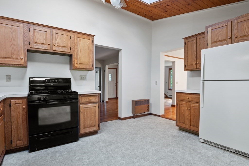54 Harriman Road Merrimac, MA 01860 - Photo 11 of 39 a kitchen with stainless steel appliances granite countertop a stove a refrigerator and a stove