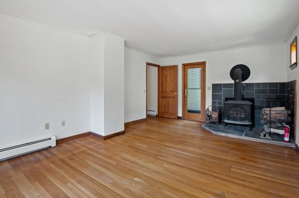 54 Harriman Road Merrimac, MA 01860 - Photo 14 of 39 a view of a livingroom with furniture and a fireplace