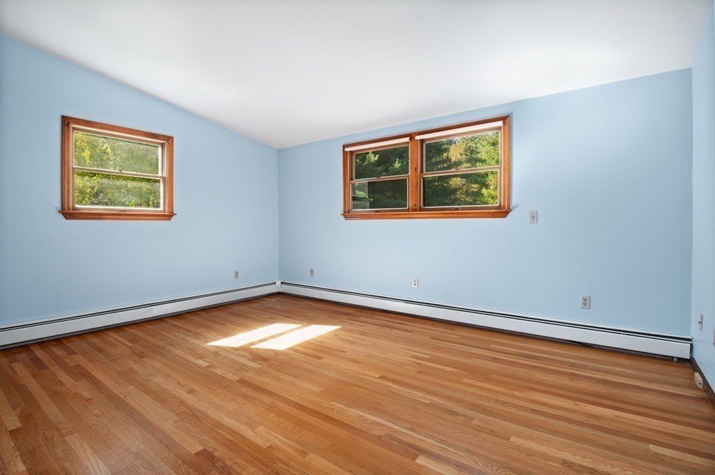 54 Harriman Road Merrimac, MA 01860 - Photo 17 of 39 a view of an empty room with wooden floor and a window