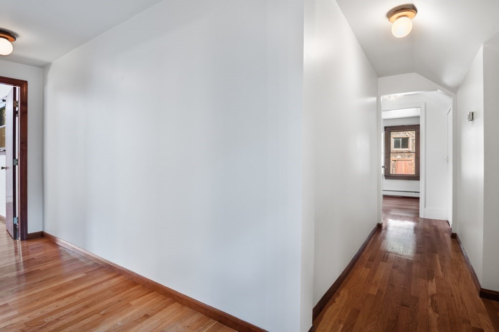 54 Harriman Road Merrimac, MA 01860 - Photo 19 of 39 a view of a hallway with wooden floor