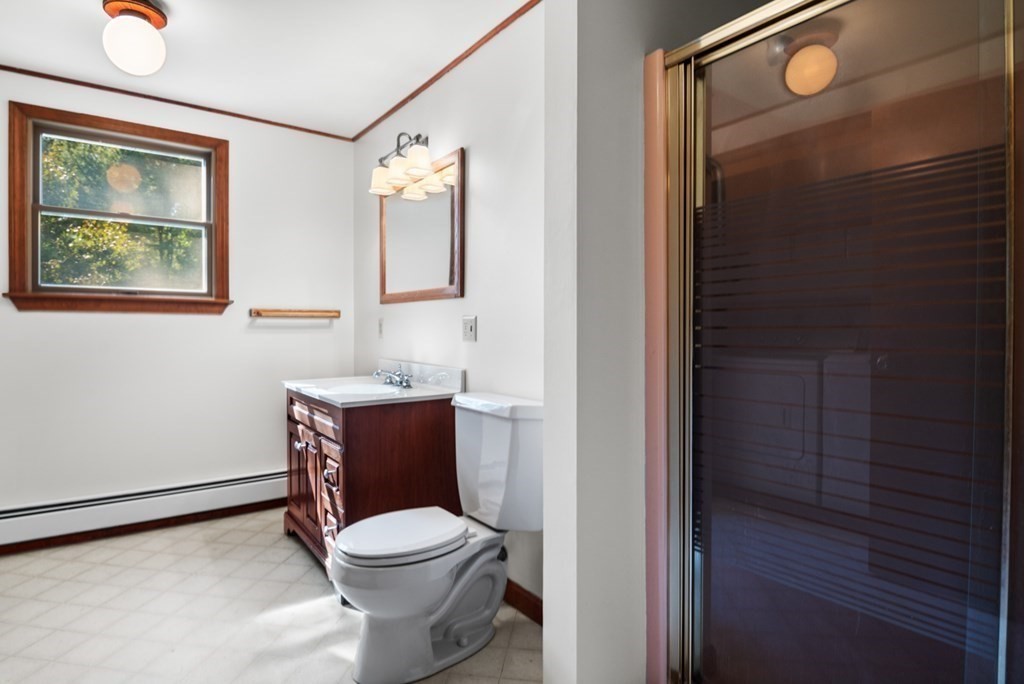 54 Harriman Road Merrimac, MA 01860 - Photo 20 of 39 a bathroom with a toilet a sink and mirror