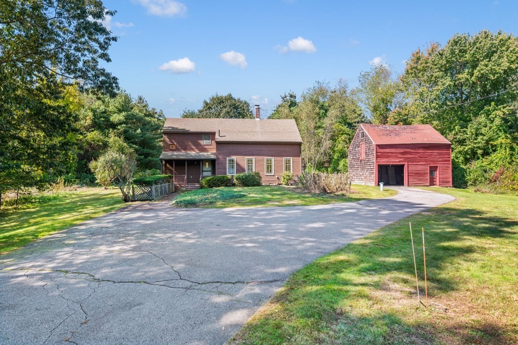 54 Harriman Road Merrimac, MA 01860 - Photo 2 of 39 a front view of house with yard and green space