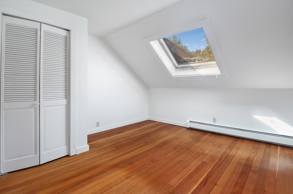 54 Harriman Road Merrimac, MA 01860 - Photo 22 of 39 an empty room with wooden floor and windows