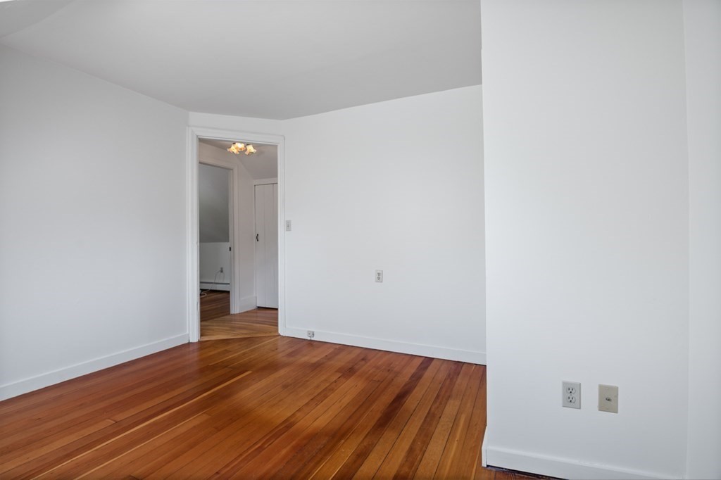 54 Harriman Road Merrimac, MA 01860 - Photo 23 of 39 a view of an empty room with wooden floor
