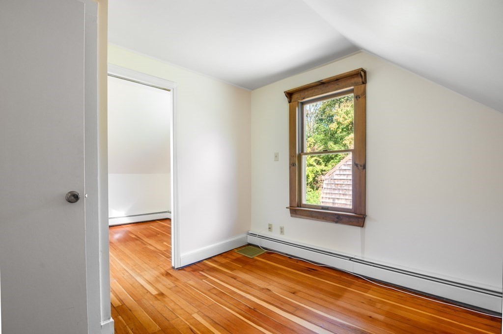 54 Harriman Road Merrimac, MA 01860 - Photo 24 of 39 a view of an empty room with wooden floor and a window