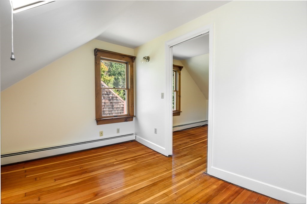 54 Harriman Road Merrimac, MA 01860 - Photo 25 of 39 an empty room with wooden floor and windows