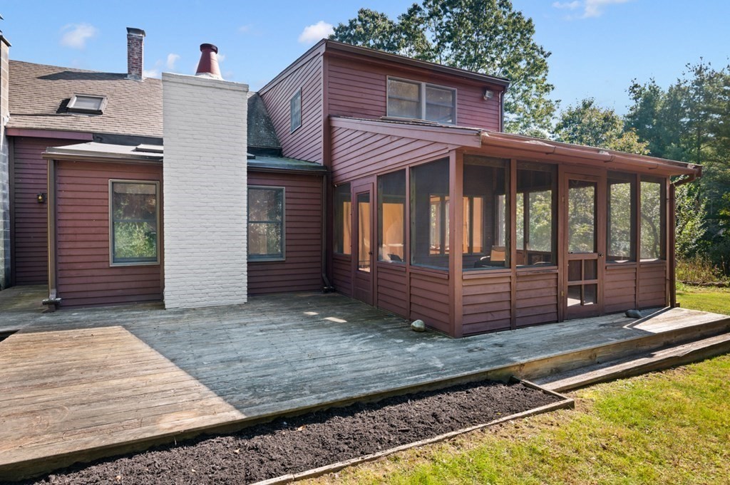 54 Harriman Road Merrimac, MA 01860 - Photo 28 of 39 a view of a house with a small yard and wooden floor and fence