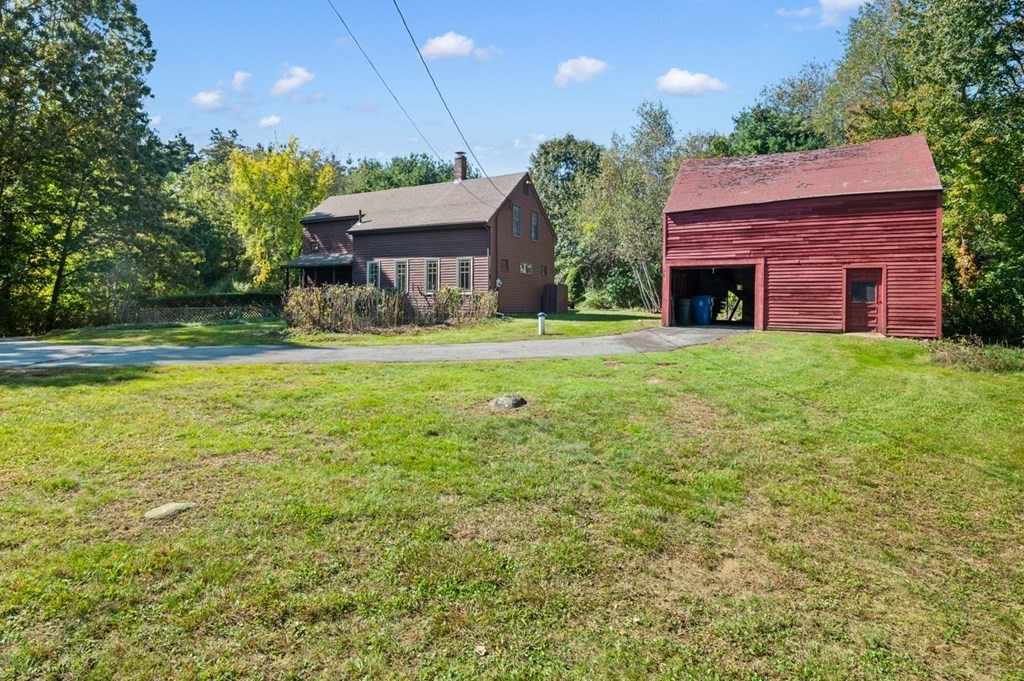54 Harriman Road Merrimac, MA 01860 - Photo 31 of 39 a front view of a house with a garden