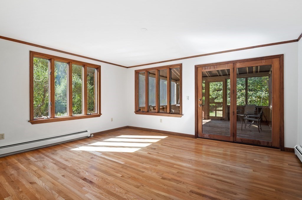 54 Harriman Road Merrimac, MA 01860 - Photo 6 of 39 a view of an empty room with glass door and balcony