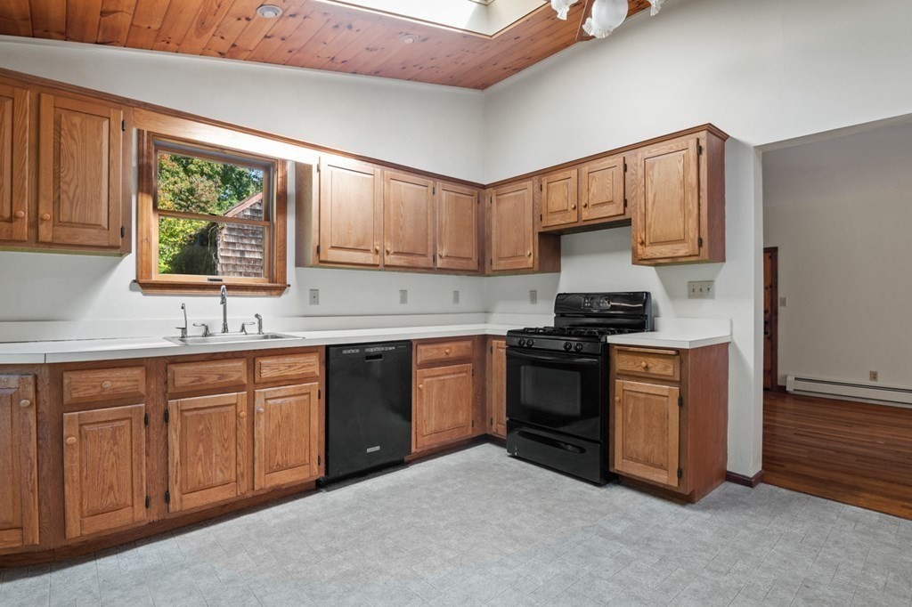 54 Harriman Road Merrimac, MA 01860 - Photo 9 of 39 a kitchen with stainless steel appliances granite countertop a stove a sink and a refrigerator