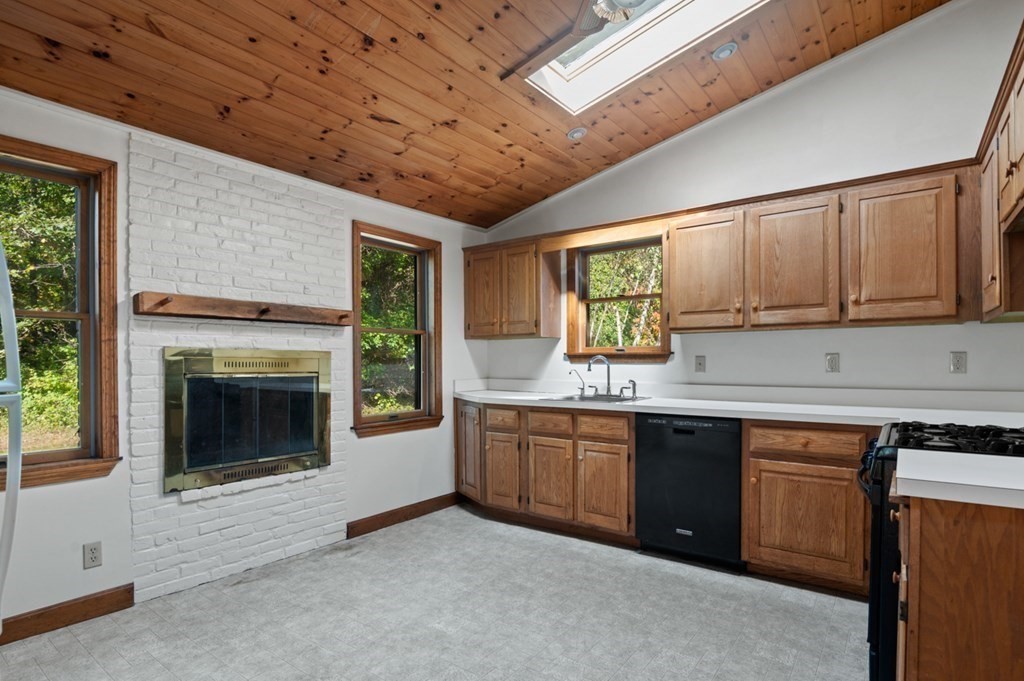 54 Harriman Road Merrimac, MA 01860 - Photo 10 of 39 a kitchen with stainless steel appliances granite countertop a stove sink and cabinets