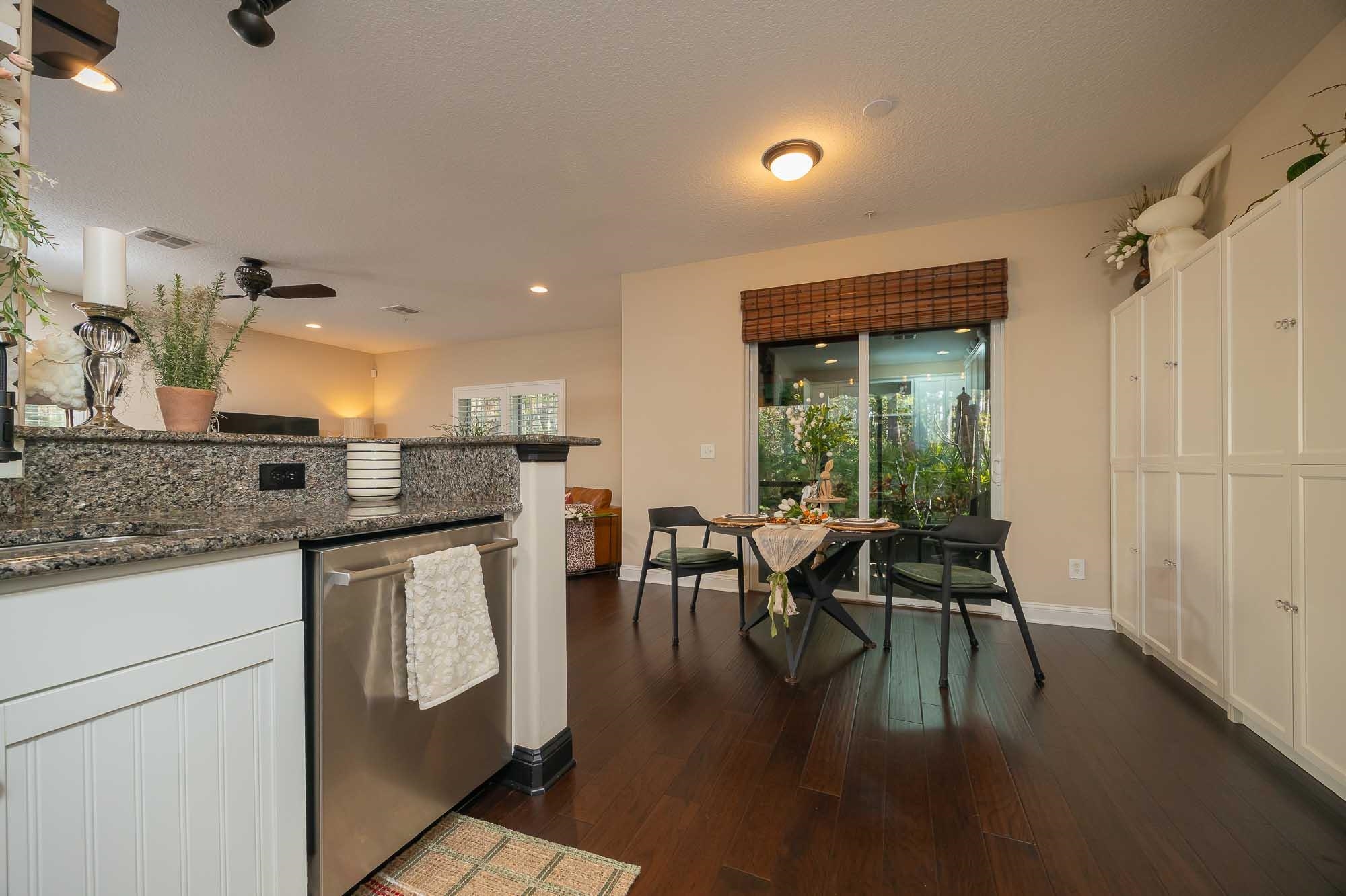 64 Grand Ravine Drive St. Augustine, FL 32086 - Photo 24 of 57 a kitchen with stainless steel appliances granite countertop a stove and a granite counter tops with white cabinets