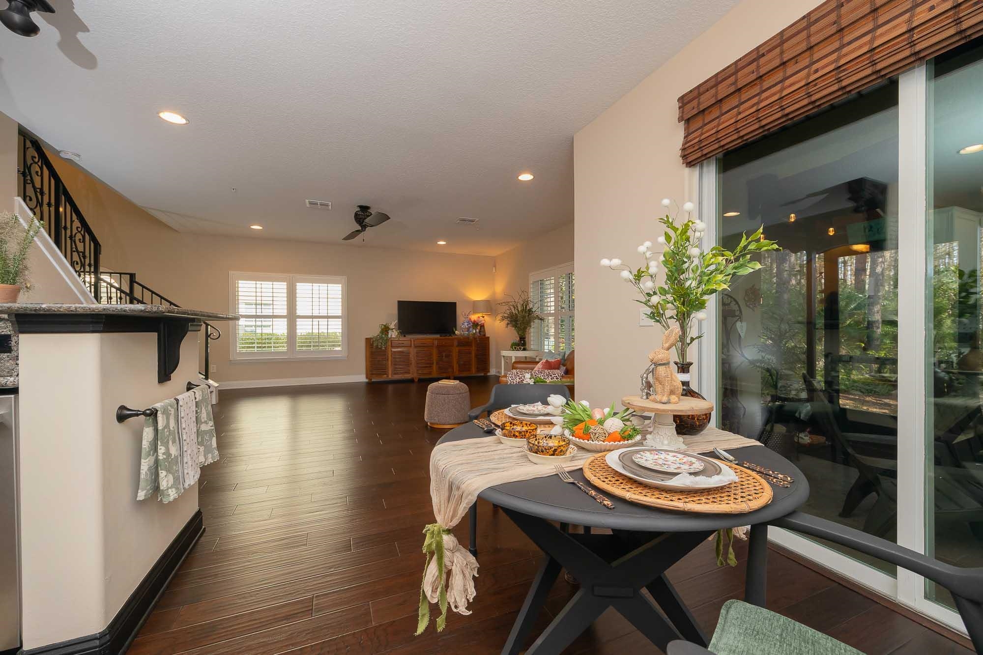 64 Grand Ravine Drive St. Augustine, FL 32086 - Photo 26 of 57 a view of a dining room with furniture and wooden floor