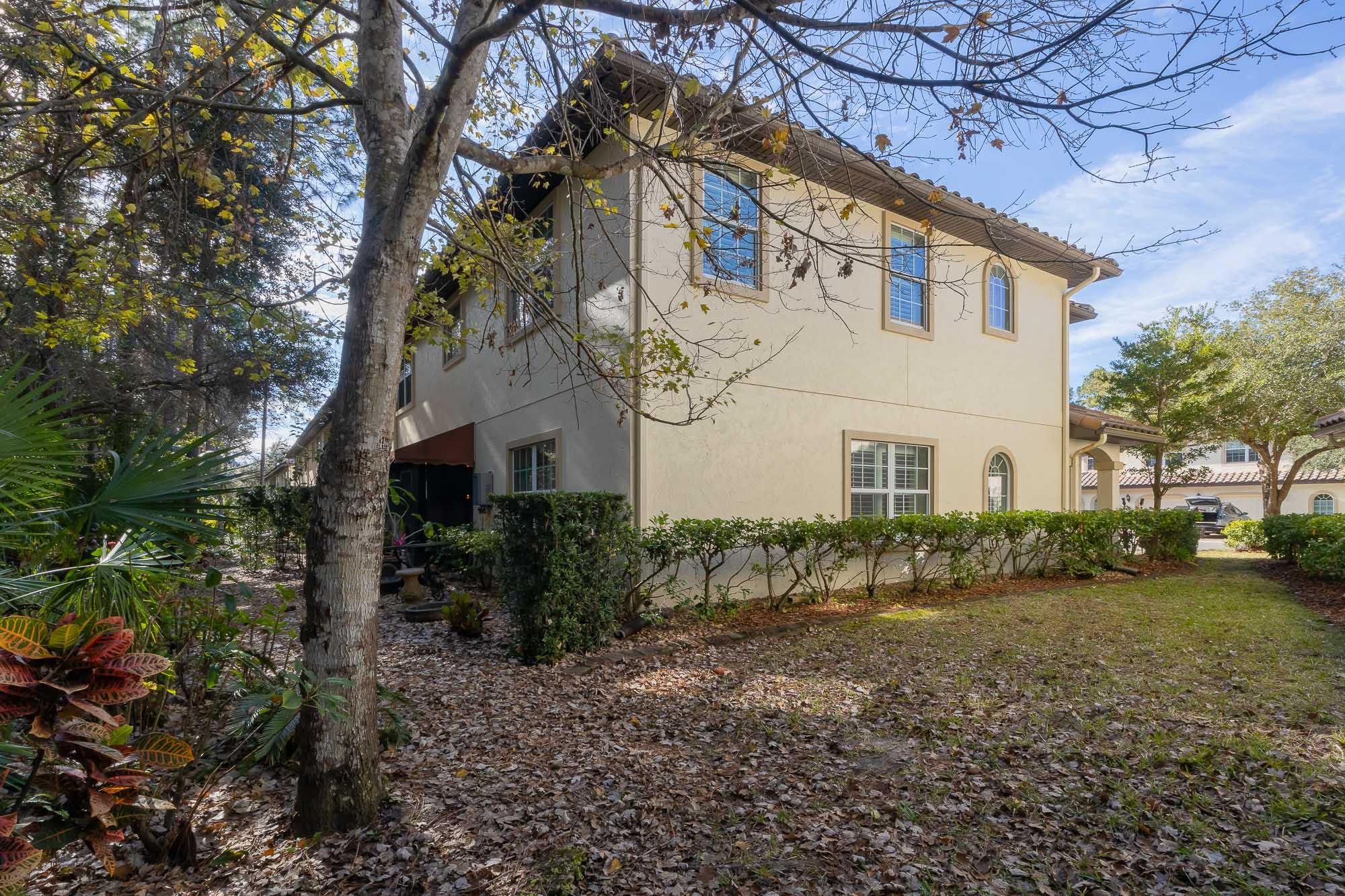 64 Grand Ravine Drive St. Augustine, FL 32086 - Photo 49 of 57 a view of a white house with a yard