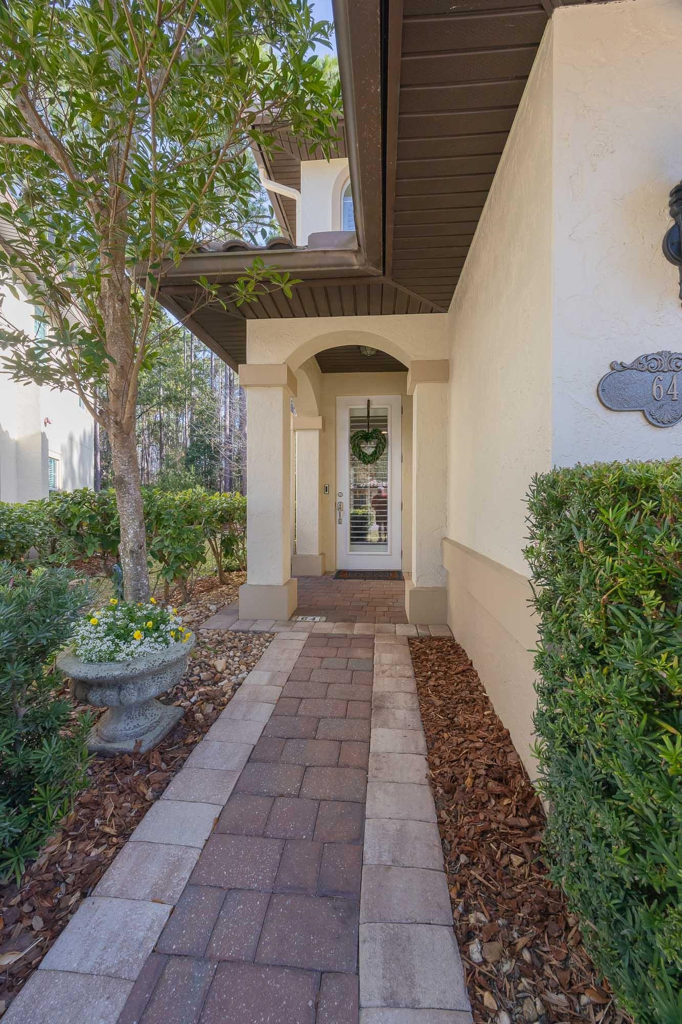 64 Grand Ravine Drive St. Augustine, FL 32086 - Photo 5 of 57 a front view of a house with a yard