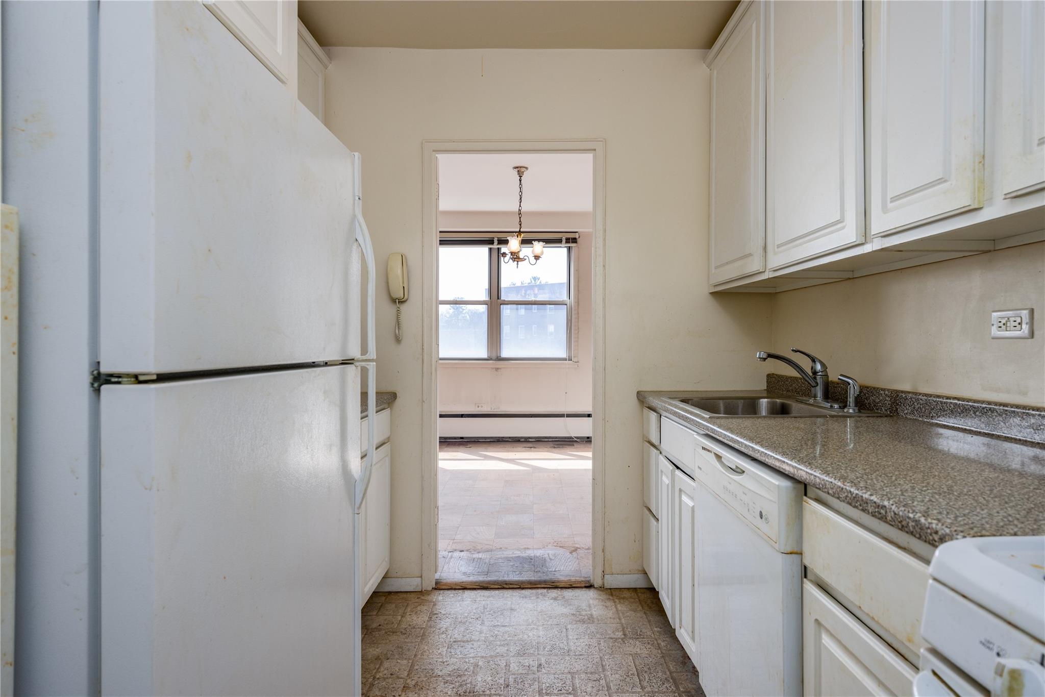 615 Palmer Road, Unit 602 Yonkers, NY 10701 - Photo 11 of 23 a kitchen with stainless steel appliances granite countertop a refrigerator and a sink