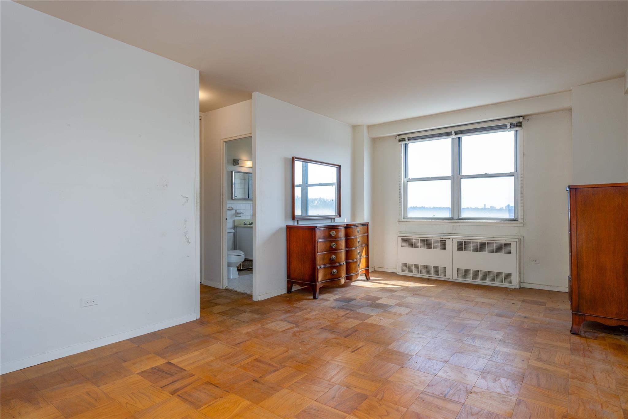 615 Palmer Road, Unit 602 Yonkers, NY 10701 - Photo 13 of 23 an empty room with windows and closet