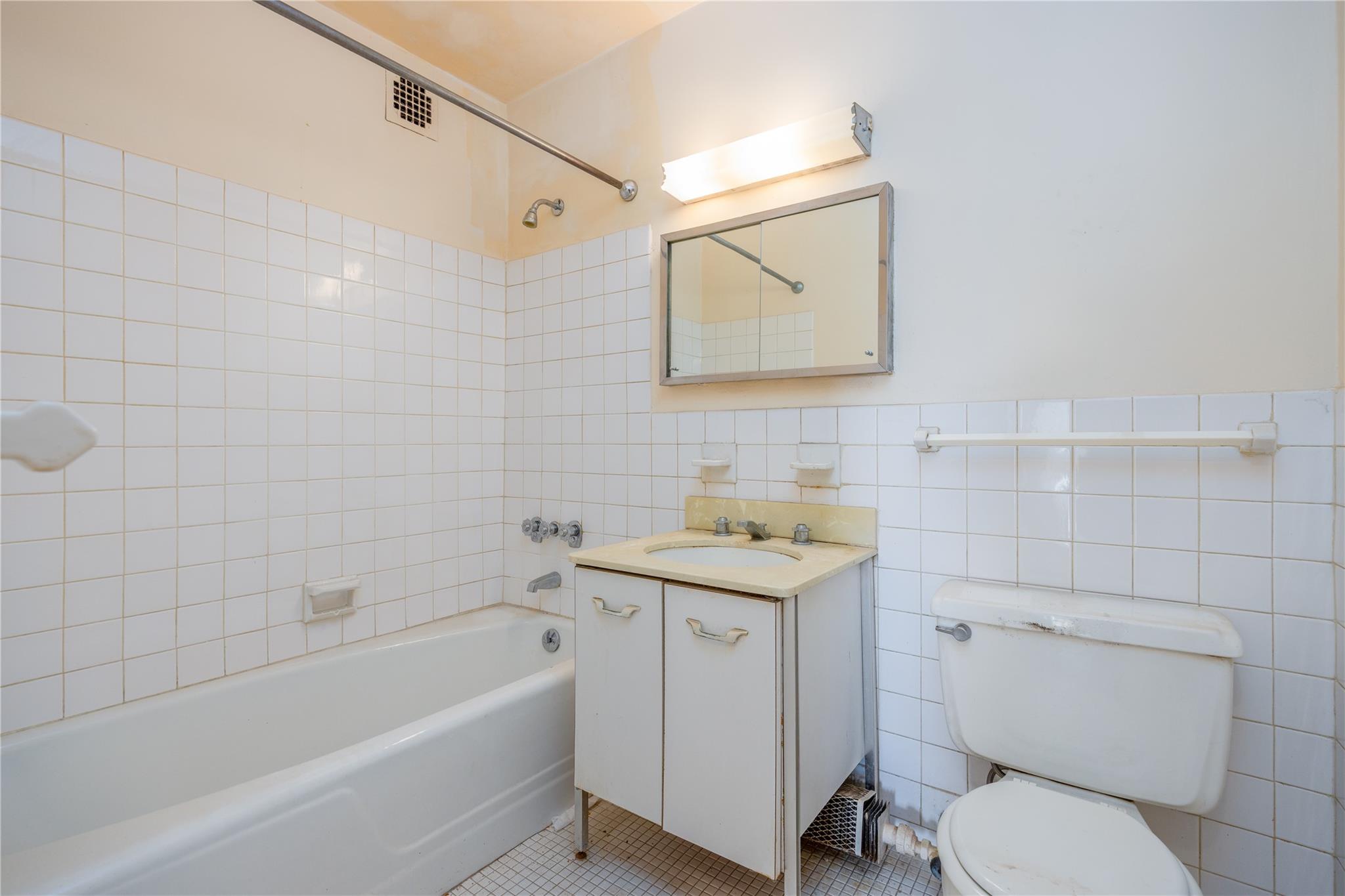 615 Palmer Road, Unit 602 Yonkers, NY 10701 - Photo 15 of 23 a bathroom with a sink toilet and vanity
