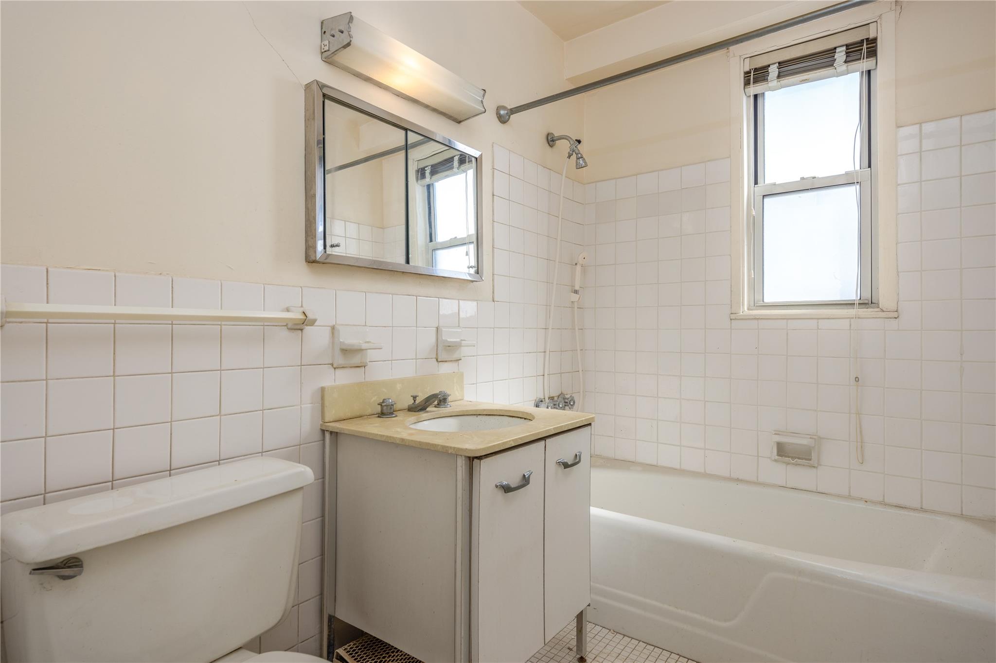 615 Palmer Road, Unit 602 Yonkers, NY 10701 - Photo 17 of 23 a bathroom with a sink toilet vanity and shower