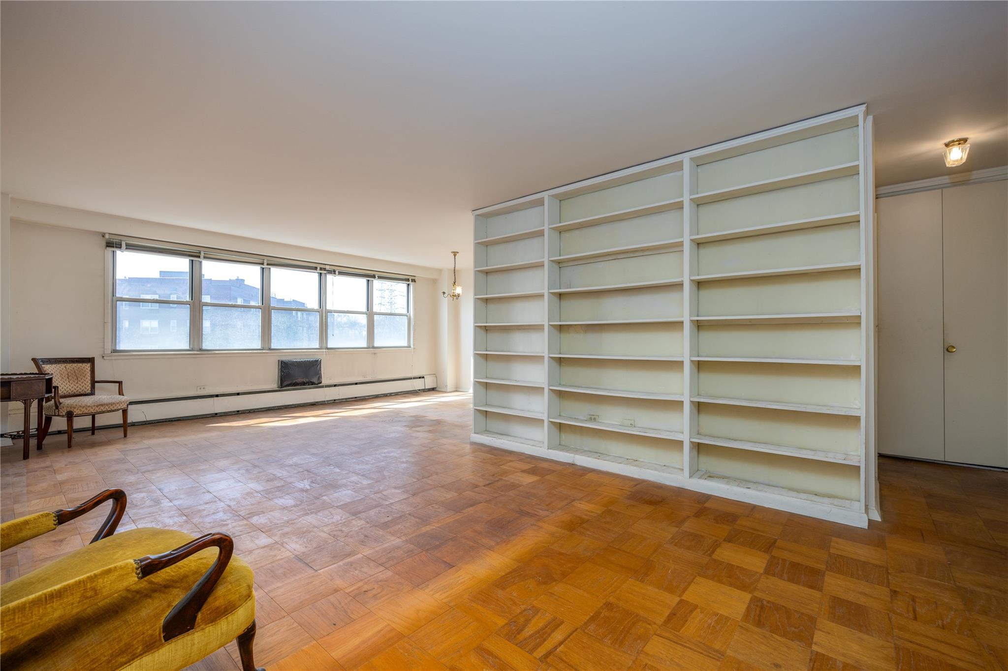 615 Palmer Road, Unit 602 Yonkers, NY 10701 - Photo 7 of 23 a room with furniture and a flat screen tv