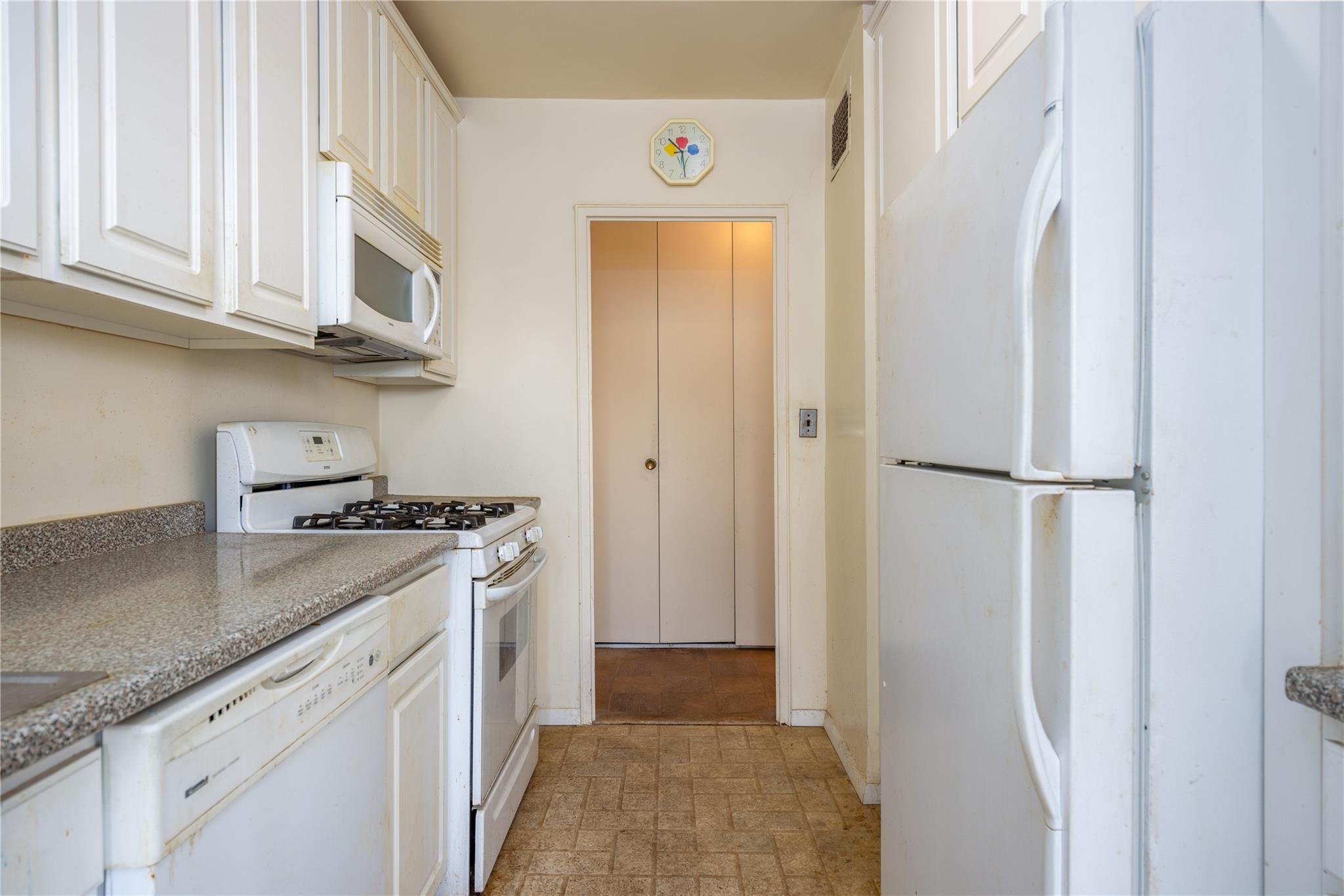 615 Palmer Road, Unit 602 Yonkers, NY 10701 - Photo 10 of 23 a kitchen with stainless steel appliances granite countertop a refrigerator and a stove