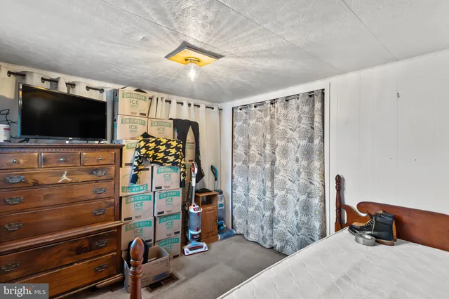 a room with furniture and flat screen tv