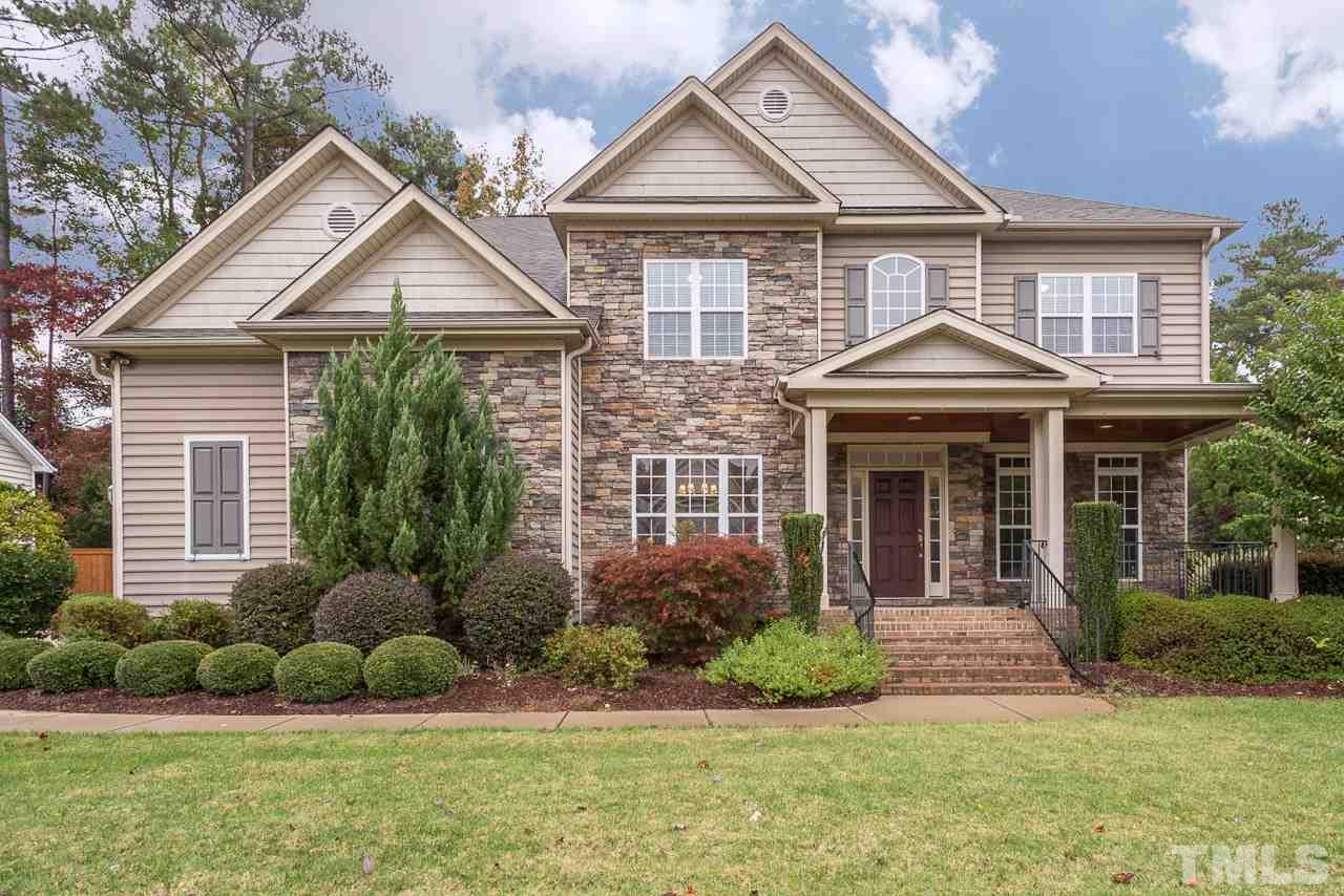 4208 Russling Leaf Lane Raleigh, NC 27613 - Photo 1 of 25 a front view of a house with garden
