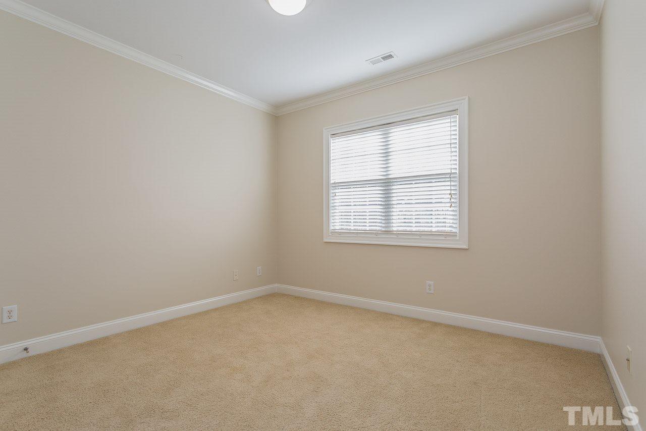 4208 Russling Leaf Lane Raleigh, NC 27613 - Photo 22 of 25 an empty room with a window