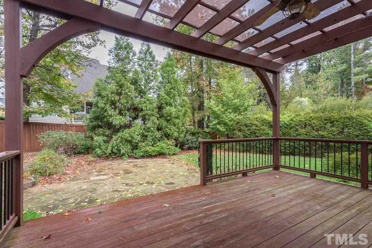 4208 Russling Leaf Lane Raleigh, NC 27613 - Photo 4 of 25 a view of a porch with wooden floor