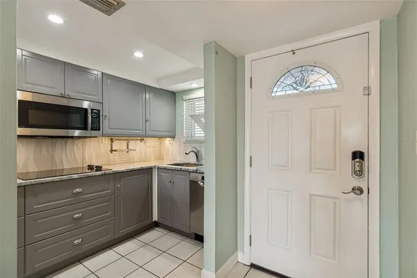 a kitchen with a sink and cabinets