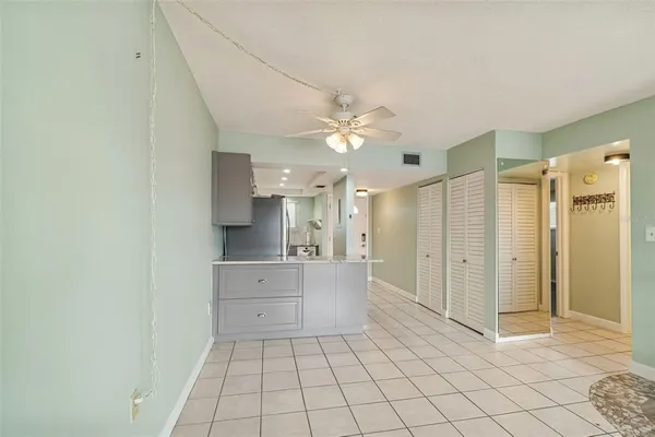 a large bathroom with a glass shower door and a bathtub