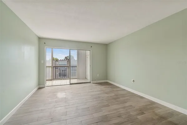 a view of an empty room with a window