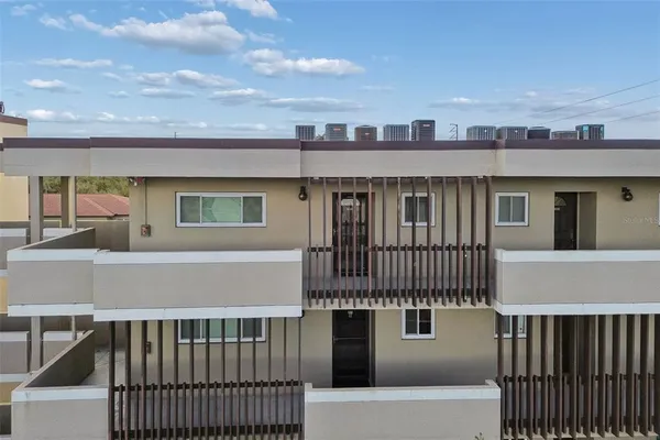a view of a house with wooden deck