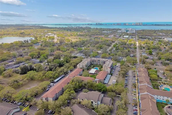 an aerial view of residential building and ocean