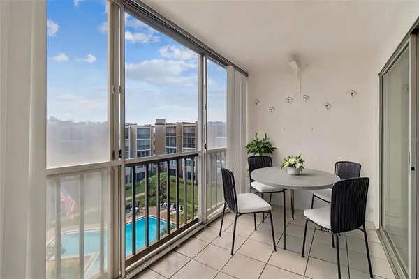 a view of a city from a dining room with furniture
