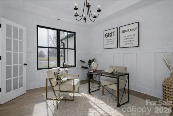 a work room with furniture and window