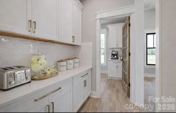 a kitchen with stainless steel appliances granite countertop a refrigerator and stove
