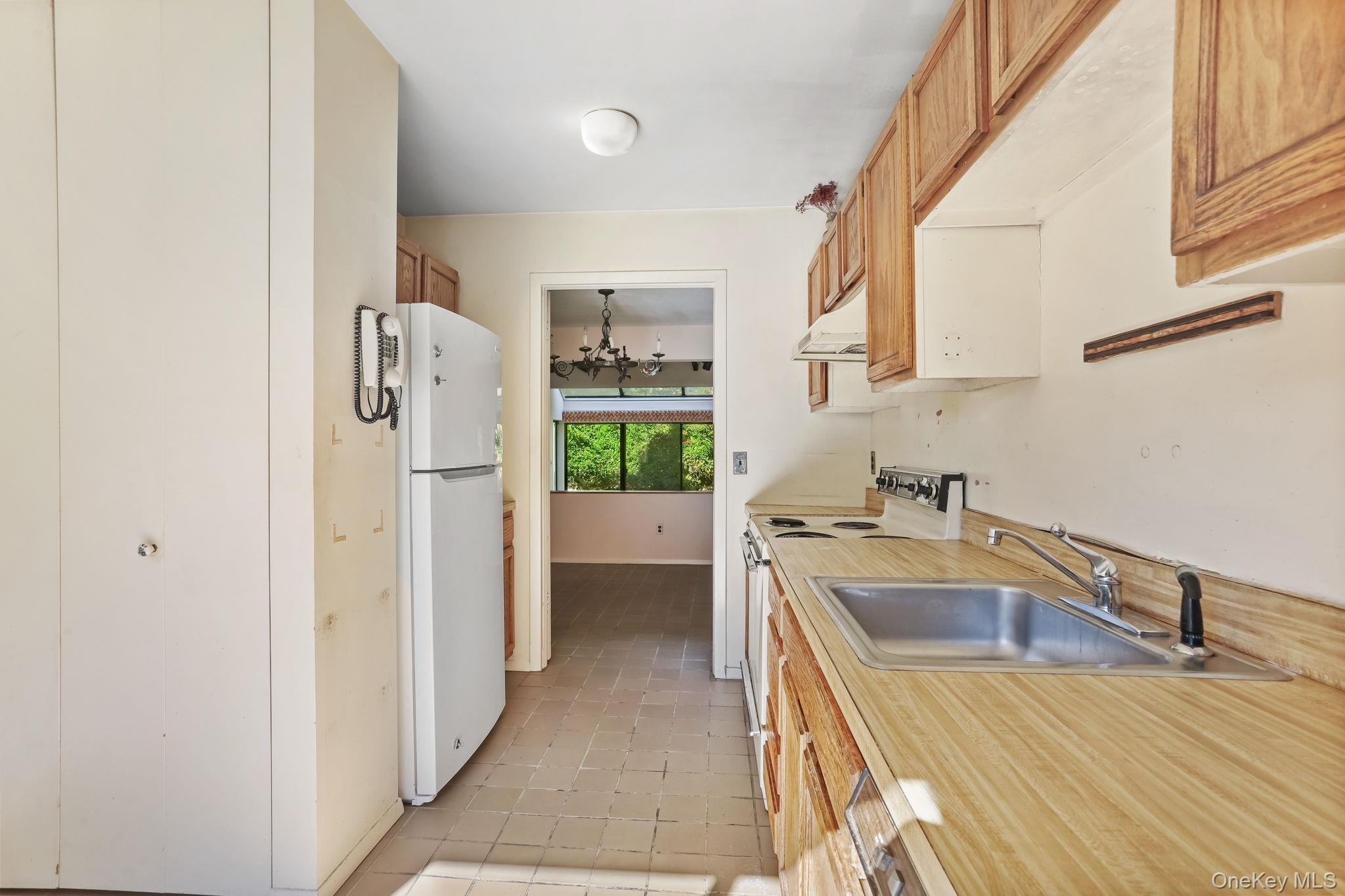 40 Pine Ridge Road Larchmont, NY 10538 - Photo 16 of 40 a kitchen that has a sink a refrigerator and a sink