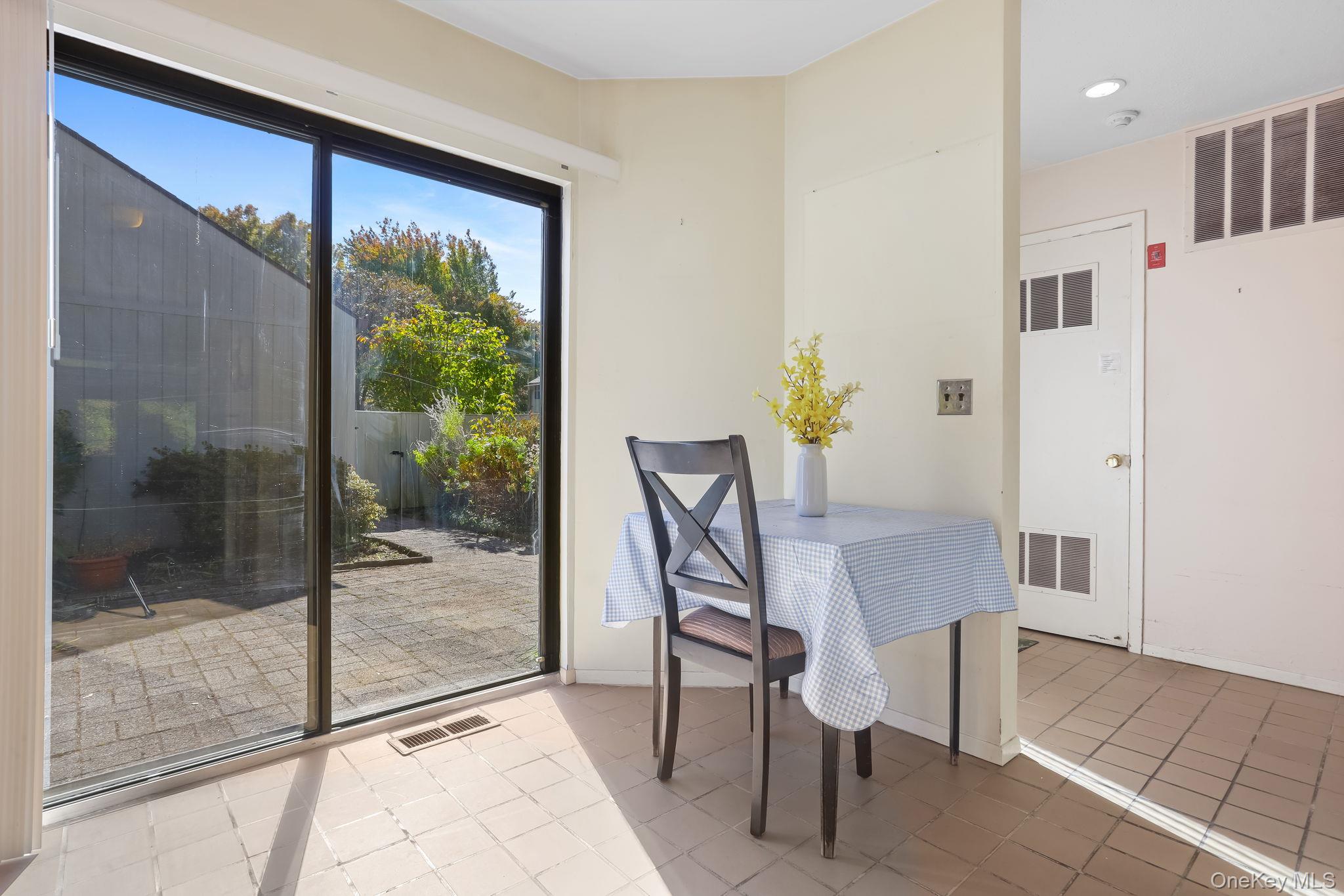 40 Pine Ridge Road Larchmont, NY 10538 - Photo 18 of 40 a dining room with furniture and a floor to ceiling window