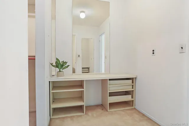 a view of a bathroom with a bathtub and shower