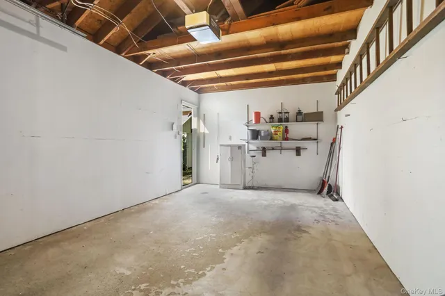 a view of a table and chairs in the green field