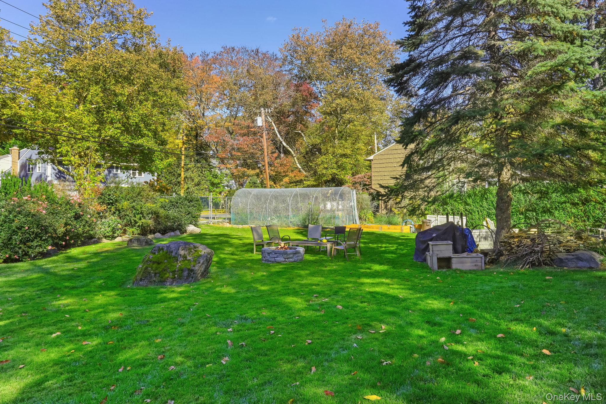 40 Pine Ridge Road Larchmont, NY 10538 - Photo 34 of 40 a view of a table and chairs in the green field
