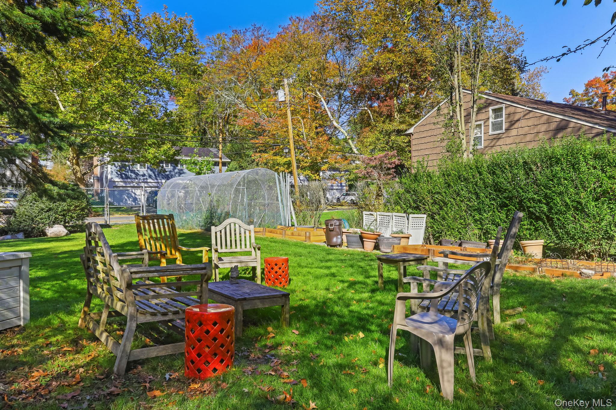 40 Pine Ridge Road Larchmont, NY 10538 - Photo 35 of 40 a view of a chairs and table in backyard of the house