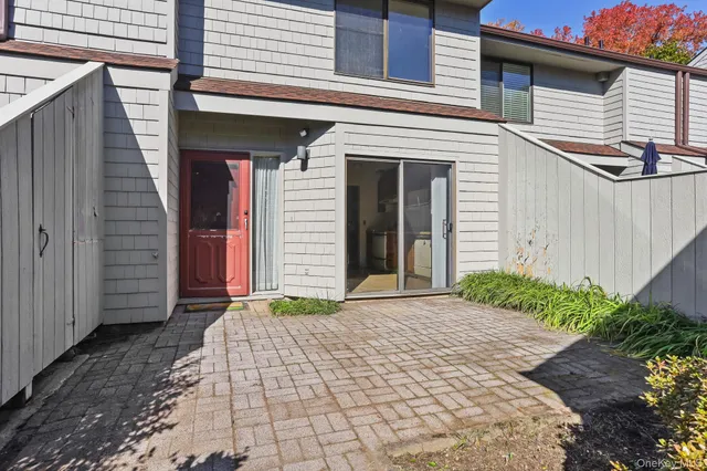 a backyard of a house with plants and trees