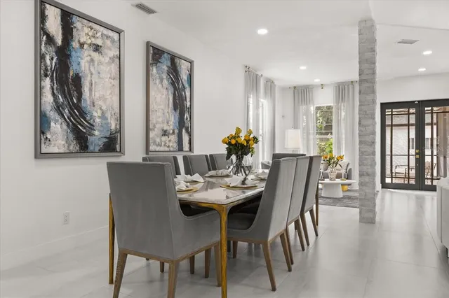 a living room with furniture a rug and a table