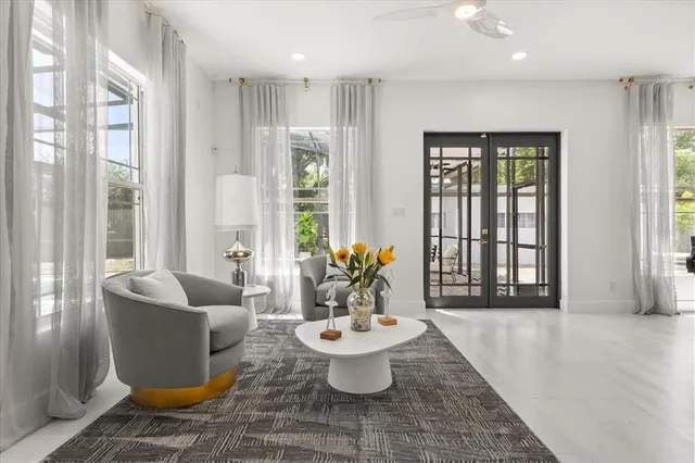 a living room with furniture and white walls