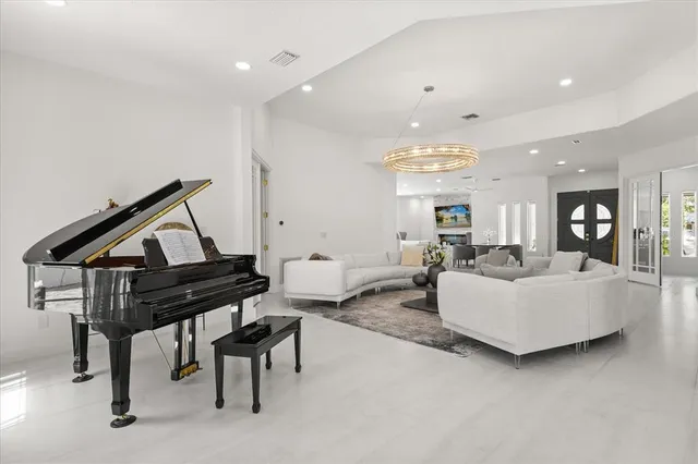 a work room with furniture windows and book shelf