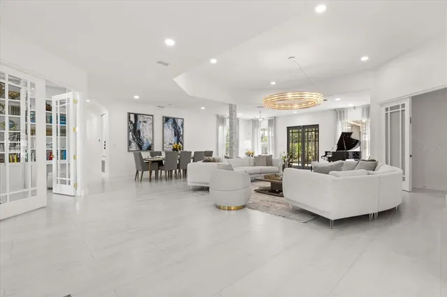 a spacious bedroom with a large bed and a dresser