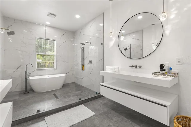 a bathroom with a sink a mirror and a toilet