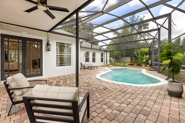 a kitchen with stainless steel appliances granite countertop a refrigerator and a stove